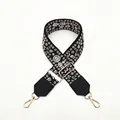 Dettaglio della tracolla ricamata con ganci dorati e fibbia di regolazione - Stile Floreale Bianco Sporco su Base Nera (No. 2)