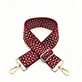 Detail view of red and black herringbone woven bag strap with golden adjustable metal buckle - No. 5 Wine Red