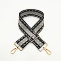 Detail of adjustable wide shoulder strap with black and grey geometric weave and gold clips - Gray (B3)