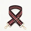 Close-up of red and black geometric zigzag pattern bag strap with gold metal buckles - Wine Red (B5)