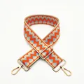 Detail of adjustable geometric patterned woven strap with gold metal spring hooks - Orange (B18)