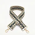 Close-up of geometric zigzag patterned woven strap with golden metal swivel hooks - Green (B20)