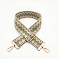 Close-up of geometric woven strap with yellow pattern and golden metal swivel hooks - Khaki Gray (B22)