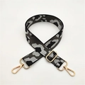 Close-up of leopard print shoulder strap with gold metal lobster clasps and buckles - Gray