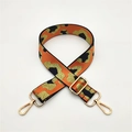 Close-up of leopard print woven strap with adjustable gold buckle and lobster clasps - Orange