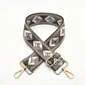 Detail of adjustable woven bag strap with geometric diamond pattern and gold metal hooks - a15 Khaki