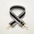 Close-up of adjustable woven shoulder strap with gray dots and gold metal swivel hooks - Light Gray Black Stripe