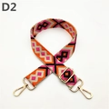 Detalle de la correa tejida con patrón de diamantes y ganchos de metal dorado - D2 Naranja Rojo Rosa