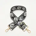 Detail of adjustable geometric diamond pattern shoulder strap with gold lobster clasps - a26 Black White