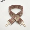 Detail of wide fabric bag strap with pink geometric pattern and gold hardware - a27 Pink