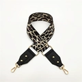 Close-up of leopard print bag strap with golden lobster clasps and adjustable buckle - Leopard Pattern Beige with Black Leather
