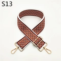 Close-up of adjustable woven bag strap with orange geometric patterns and gold metal buckles - Burgundy
