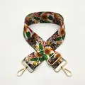 Detail of adjustable canvas bag strap with sunflower pattern and gold metal hardware - Sunflower