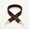 Detail of adjustable woven bag strap with retro geometric patterns and gold lobster clasps - Brown