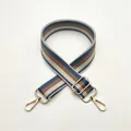 Detail of adjustable blue and brown striped woven shoulder strap with gold metal hooks - No.8 Lake Blue