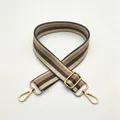 Detailed view of adjustable brown striped woven bag strap with golden lobster clasps - No.18 Khaki