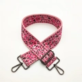 Close-up of pink jacquard replacement bag strap with floral patterns and bronze metal buckles - Rose Pink Gunmetal Buckle
