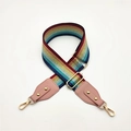 Detail of adjustable rainbow striped bag strap with gold metal hooks and pink leather ends - Multicolor + Pink Leather