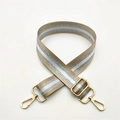 Adjustable woven strap with gold metal buckles and three-stripe metallic silver detail - Khaki