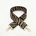 Adjustable woven handbag strap with classic zebra pattern and gold metal hardware - No. 44 Khaki