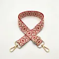 Detail of red and white geometric woven bag strap with golden metal swivel hooks and buckle - Red (No.1)