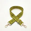 Detailed close-up of woven yellow and black geometric purse strap with gold metal buckle - Yellow (No. 2)