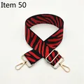 Detail view of adjustable zebra stripe bag strap with gold metal lobster clasps - Silver Clasp / No. 50 Red