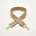 Detail view of woven diamond pattern bag strap in brown and beige with gold hardware - Brown (No.5)