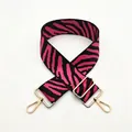 Detail of adjustable pink and black zebra pattern strap with gold metal hooks and buckle - No. 52 Magenta