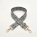 Close-up of black and white geometric woven replacement shoulder strap with gold buckles - Black (No. 6)