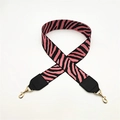 Close-up of pink and black zebra pattern wide shoulder strap with gold swivel lobster clasps - Hot Pink + Black Leather