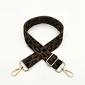 Detail of leopard print bag strap with polished gold-tone metal hooks and adjustable buckle - Silver Clasp / Style 7 Black Leopard