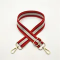 Close-up of red and grey striped woven bag strap with golden metal swivel hooks - Orange Red (No. 7)