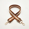 Detail of adjustable three-color woven shoulder strap with gold metal lobster clasps - Brown