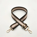 Close-up of adjustable striped handbag strap with gold metal hooks and glitter gold lines - Dark Gray