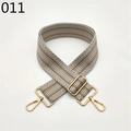 Detail of wide adjustable woven bag strap with brown wavy patterns and gold metal hardware - Brown and White Wave Pattern (011)