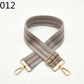 Macro shot of adjustable herringbone woven handbag strap with gold lobster clasps - Brown and White Fishbone (012)