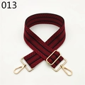 Close-up of a wide red and black geometric woven bag strap with golden lobster clasps - Red and Black Twill (013)