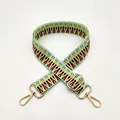 Detail of colorful geometric woven replacement strap with polished gold metal hooks - Patchwork Green