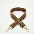 Detailed close-up of ethnic geometric woven bag strap with gold metal lobster clasps - Silver Clasp / Khaki Brown