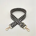 Detail of black and white geometric woven replacement strap with gold metal hooks - Blue