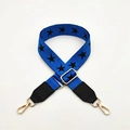 Detail of adjustable blue strap with black star patterns and gold metal buckles - Blue with Black Leather Trim