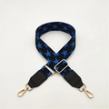 Detail of adjustable black bag strap with blue star pattern and gold metal lobster clasps - Dark Blue with Black Leather