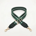 Close-up of dark green canvas shoulder strap with white herringbone pattern and gold hardware - Green