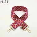 Macro detail of geometric magenta woven bag strap with golden metal swivel hooks - Rose Red Pattern (H-21)