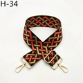 Detail view of retro geometric wide bag strap with orange and gold weave and metal hooks - Orange Pattern (H-34)