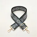 Detail of adjustable wide bag strap with geometric snowflake jacquard and gold hardware - White Light Blue (I-6)