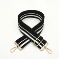 Detail of wide black and white striped canvas strap with adjustable gold metal buckle - Black (No.11)