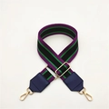 Detail of adjustable woven striped bag strap with purple green colors and gold metal hooks - Black Purple Stripes Blue Leather