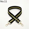 Detail view of adjustable black and green striped shoulder strap with gold metal buckle - No. 11 Black Light Gold Stripe